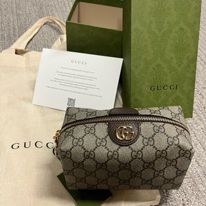 Authentic Gucci Cosmetic bag 100% . NWT.